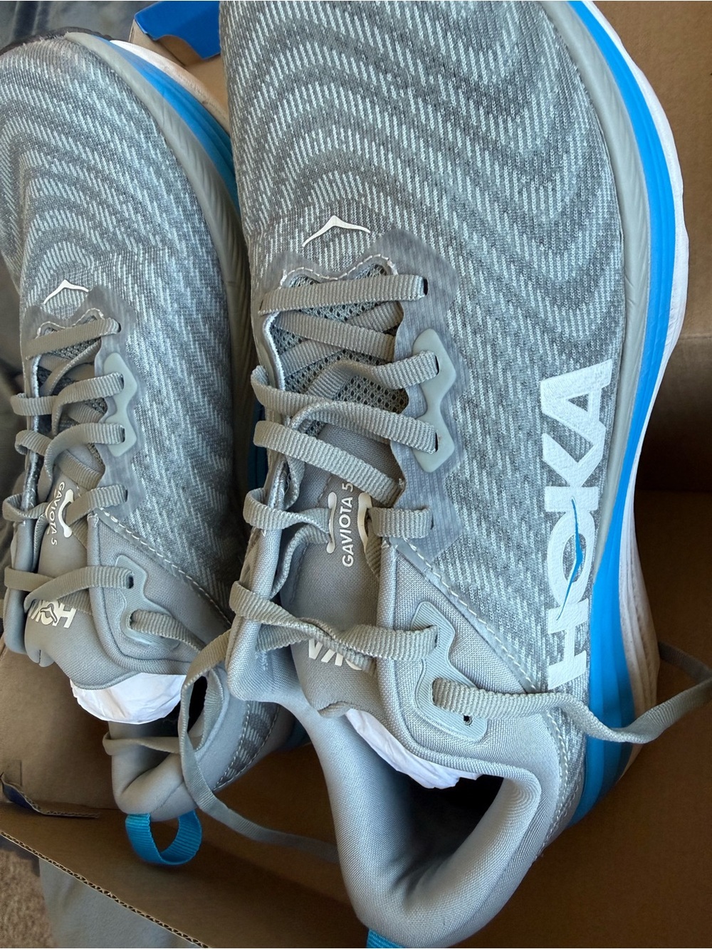 Hoka Men's Gray Running Shoes with Blue Midsole Accent gently worn like new 9.5